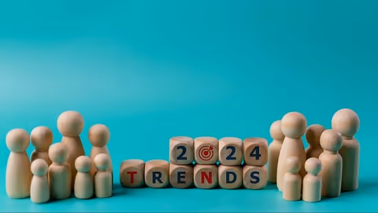 Wooden figures of people and wooden cubes with the text “2024 Trends”. Wooden figures of people and wooden cubes with the text “2024 Trends”.