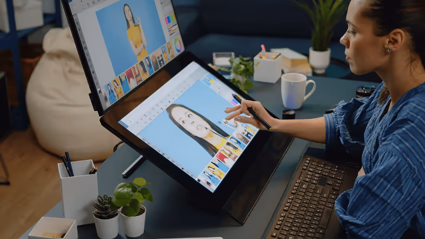 A person using a computer screen to create content, such as editing an image. A person using a computer screen to create content, such as editing an image.