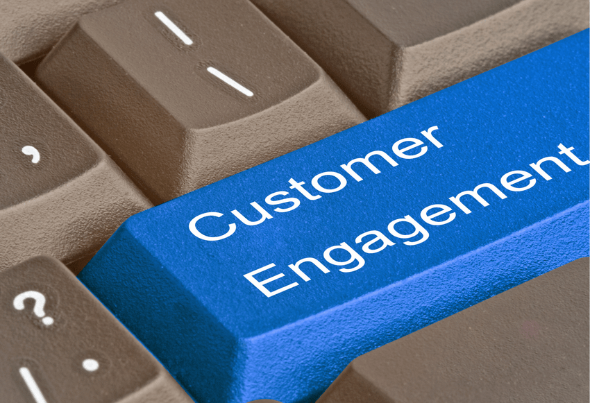 A keyboard key labeled "Customer Engagement" A keyboard key labeled "Customer Engagement"