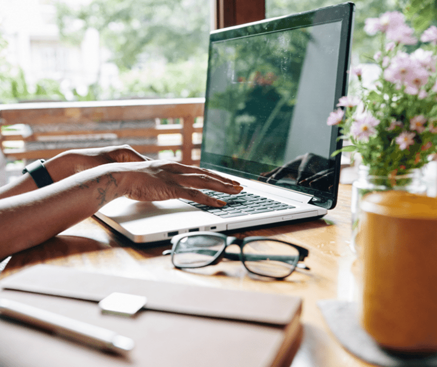 A person working remotely using a laptop