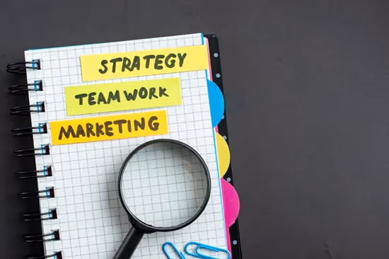 Notebook with magnifying glass and paperclips on it. Notebook with magnifying glass and paperclips on it.