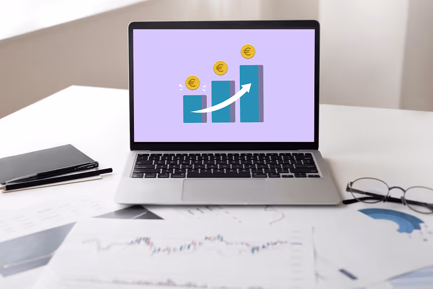 A laptop whose screen displays an image showing a graph about increased revenue due to using interac A laptop whose screen displays an image showing a graph about increased revenue due to using interac