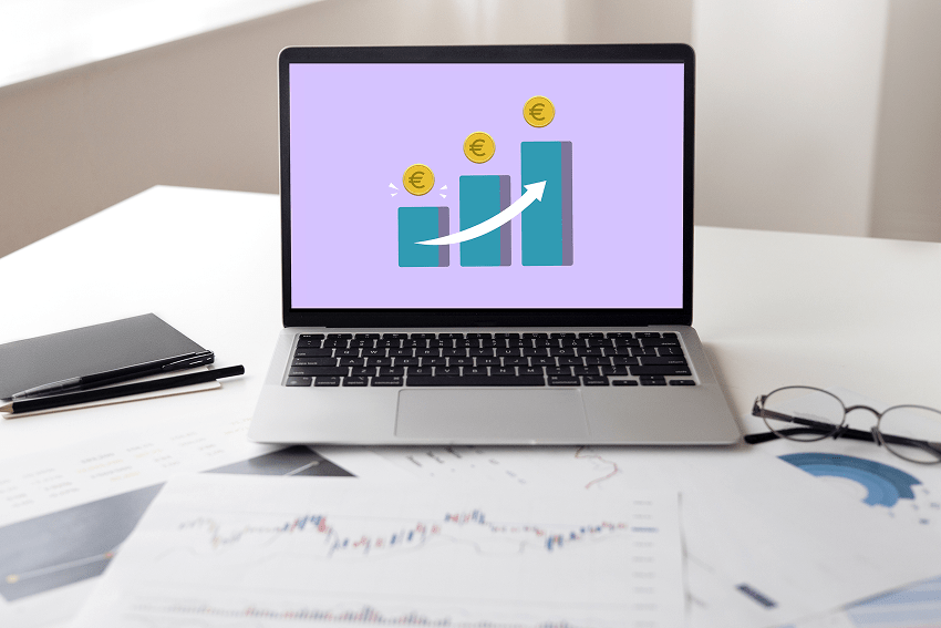 A laptop whose screen displays an image showing a graph about increased revenue due to using interac