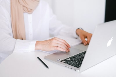 Woman typing on laptop