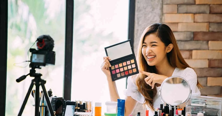 Make-up influencer making a video