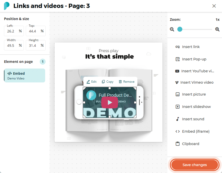 The embedded video now appears centered on the flipbook page with a play button visible.