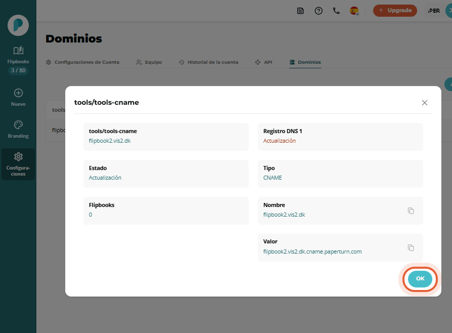 Modal de detalles de CNAME mostrando los registros DNS y el botón “OK” resaltado. Modal de detalles de CNAME mostrando los registros DNS y el botón “OK” resaltado.