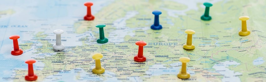Colorful pins on a map of Europe