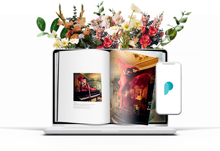 A flipbook on a laptop with flowers coming out of the laptop.