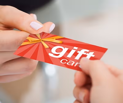 Image of someone giving a gift card to another
