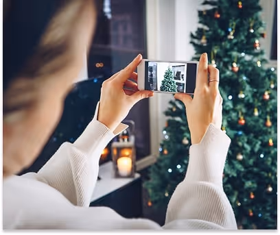 Woman taking festive pictures for a social media post