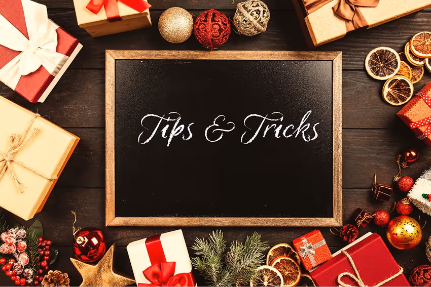 Frame with the word 'Tips and Tricks' written, around Christmas gifts and decorations Frame with the word 'Tips and Tricks' written, around Christmas gifts and decorations