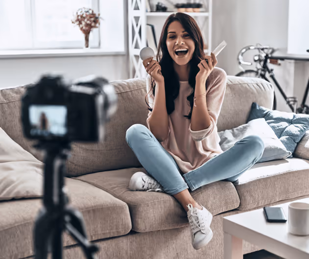 Influencer showing products in front of her camera Influencer showing products in front of her camera