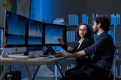 Business woman and man working on a computer Business woman and man working on a computer