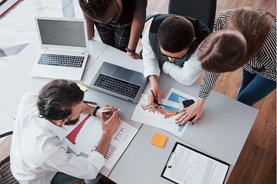 Team working together. Source: Freepik