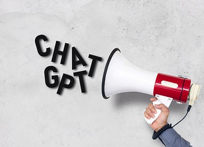 The hand holds the megaphone at an angle, ready to be used. Next to the hand and megaphone, there is