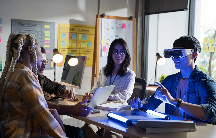Group of people using and testing new technology