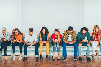 People looking at their phones