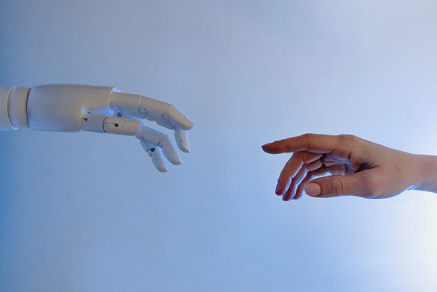 Robot and human hands touching