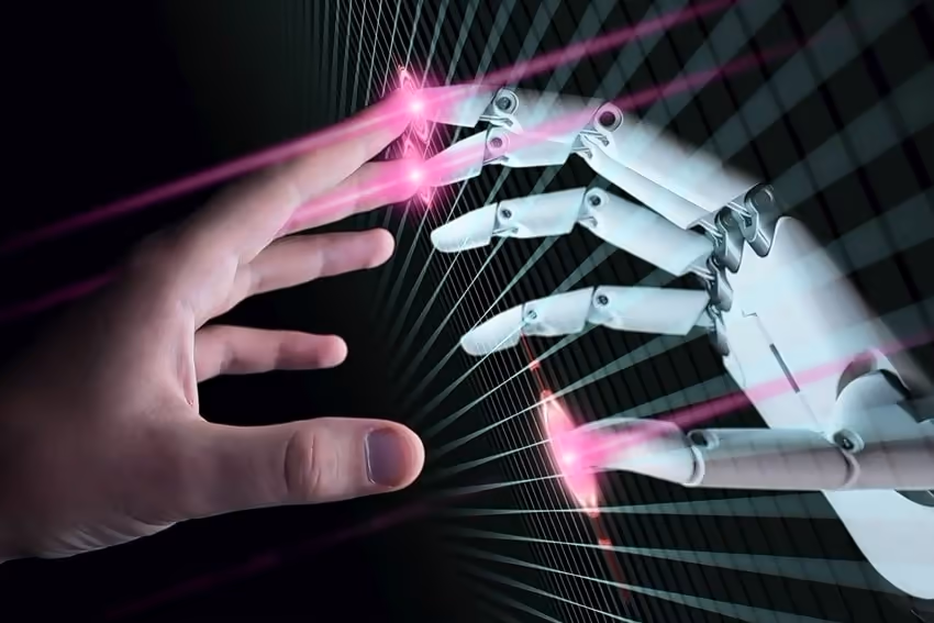 Two hands - a human one and a robotics one. Two hands - a human one and a robotics one.