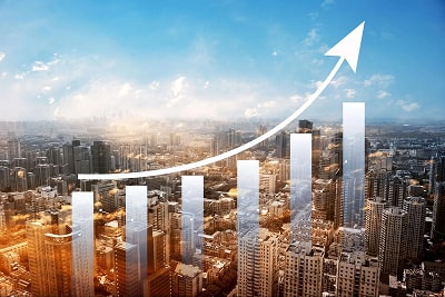 A graph on top of the city showcasing growth