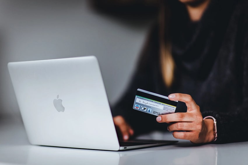 Person shopping online using a laptop
