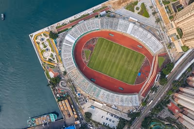 Aerial view of a sports stadium showing the field and surrounding areas. Aerial view of a sports stadium showing the field and surrounding areas.