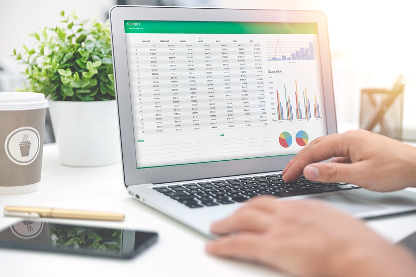 Somebody working on a digital spreadsheet calculating revenue