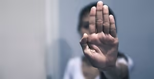Woman signalling “stop”
