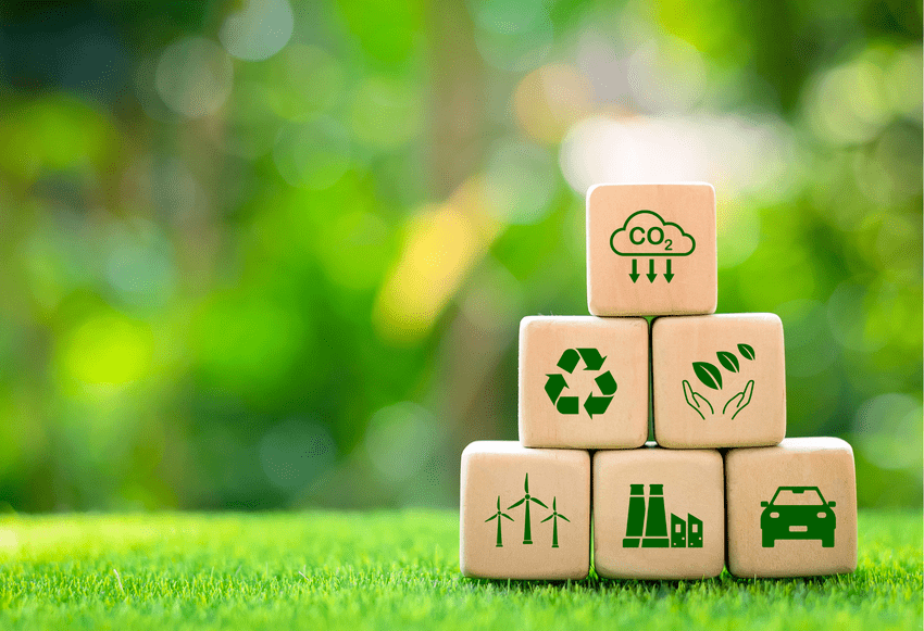 Wooden building blocks with sustainability symbols on them Wooden building blocks with sustainability symbols on them