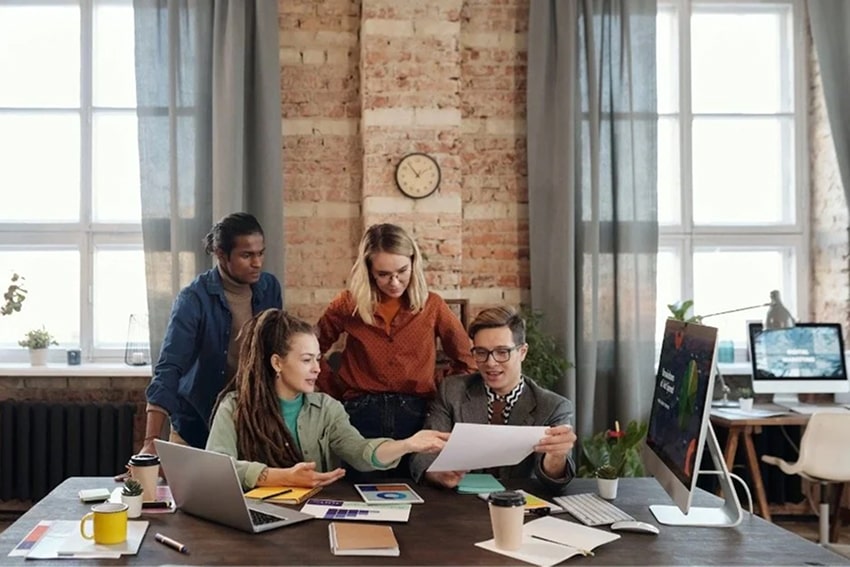 Team working together. Source: Pexels
