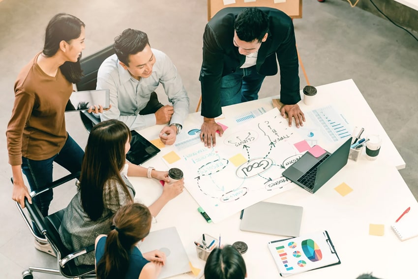 A group of people in meeting.