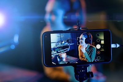 Woman recording a video with her phone