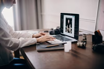 A woman working on her laptop.