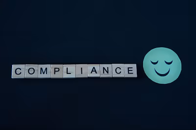 A picture with the word “compliance” and a smiley emoji. A picture with the word “compliance” and a smiley emoji.
