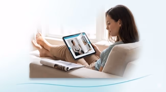 A woman relaxing on a sofa reads a digital magazine on a tablet, a printed magazine set aside beside her. A woman relaxing on a sofa reads a digital magazine on a tablet, a printed magazine set aside beside her.