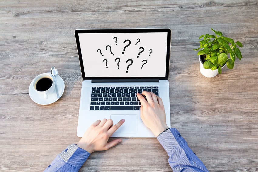 A laptop screen showing lots of question marks that refer to the question of what interactive conten