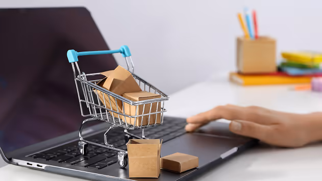 Image of a small Shopping sitting on top of a Computer Image of a small Shopping sitting on top of a Computer