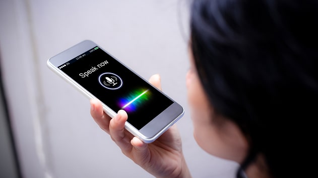 A person using a smartphone for voice search.